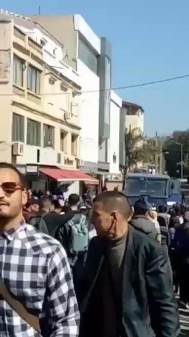 Algeria: Students face the water cannon near the Canadian Embassy in Algiers and chant assassin power while the police prevents them from approaching the constitutional council where the candidacy submition is being held