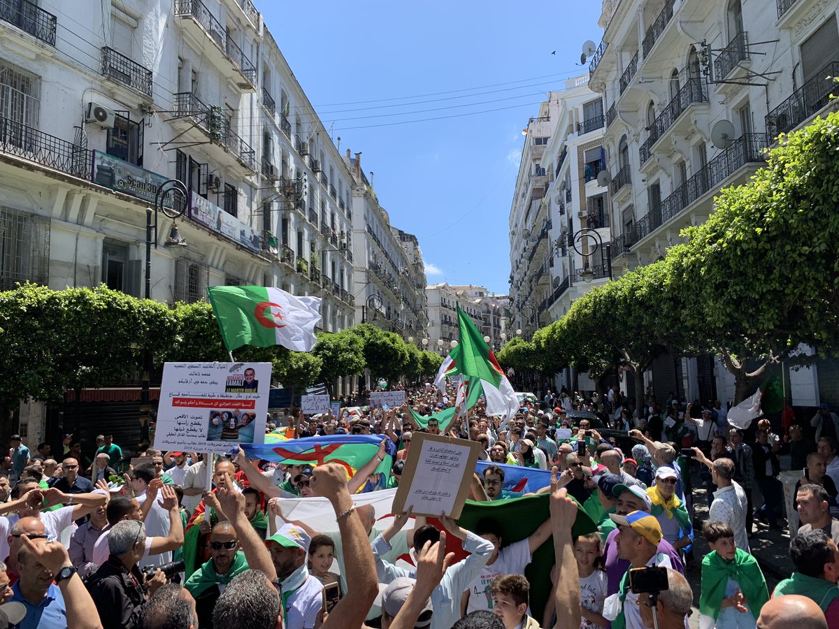 13h55 several thousand people on Didouche Mourad street Algiers chanting slogans Murderous regime No to the military government