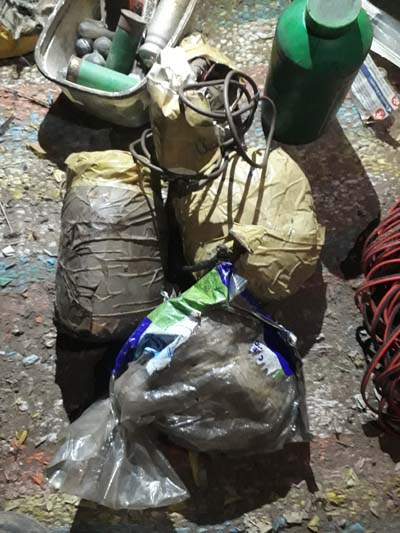 Algeria- MDN photos from militants' hideout discovered in Constantine, including a Beretta 950 and a whole bunch of IEDs, grenades & other equipment